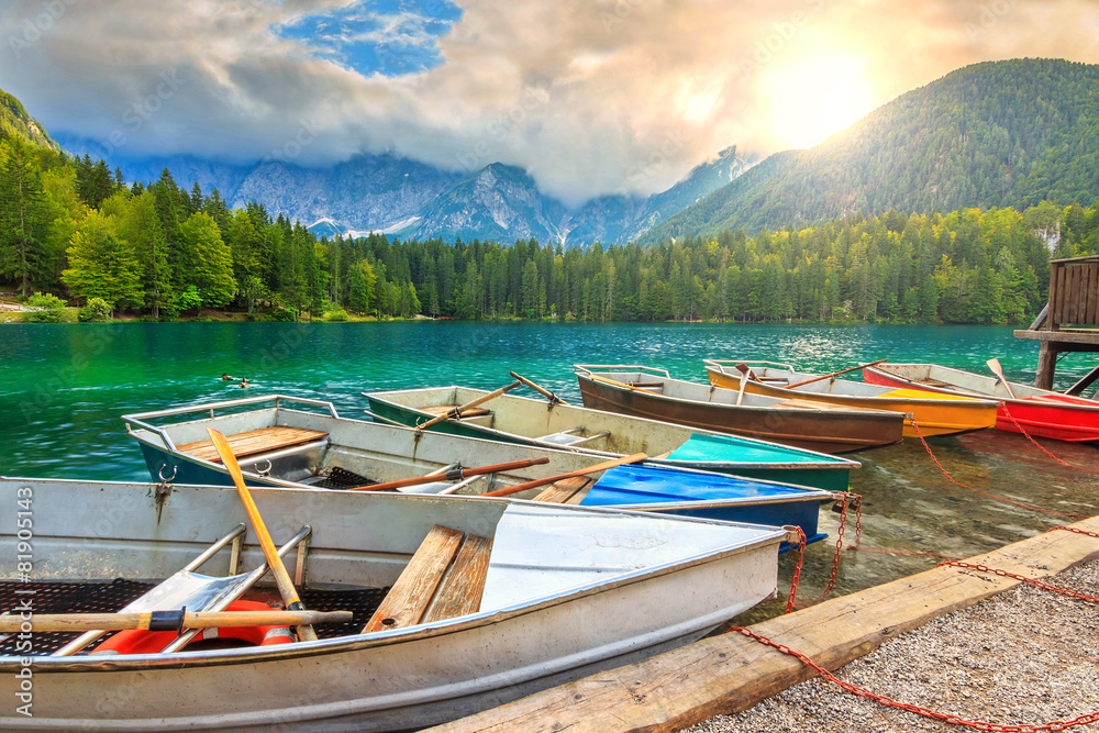 Stunning alpine landscape and colorful boats,Lake Fusine,Italy