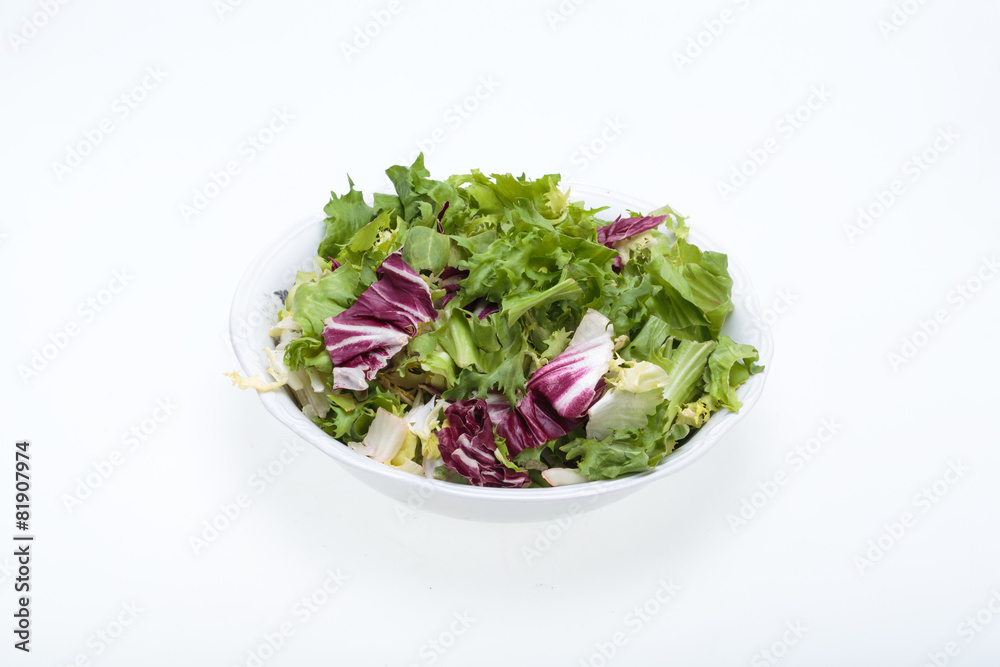 Green and red leaf of lettuce . Isolated on a white background Green and red leaf of lettuce . Isolated on a white background