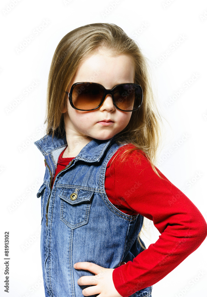 Cute little girl posing in mother's sunglasses, childhood concep Cute little girl posing in mother's sunglasses, childhood concep