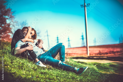 Pretty couple rest outdoor in the forest