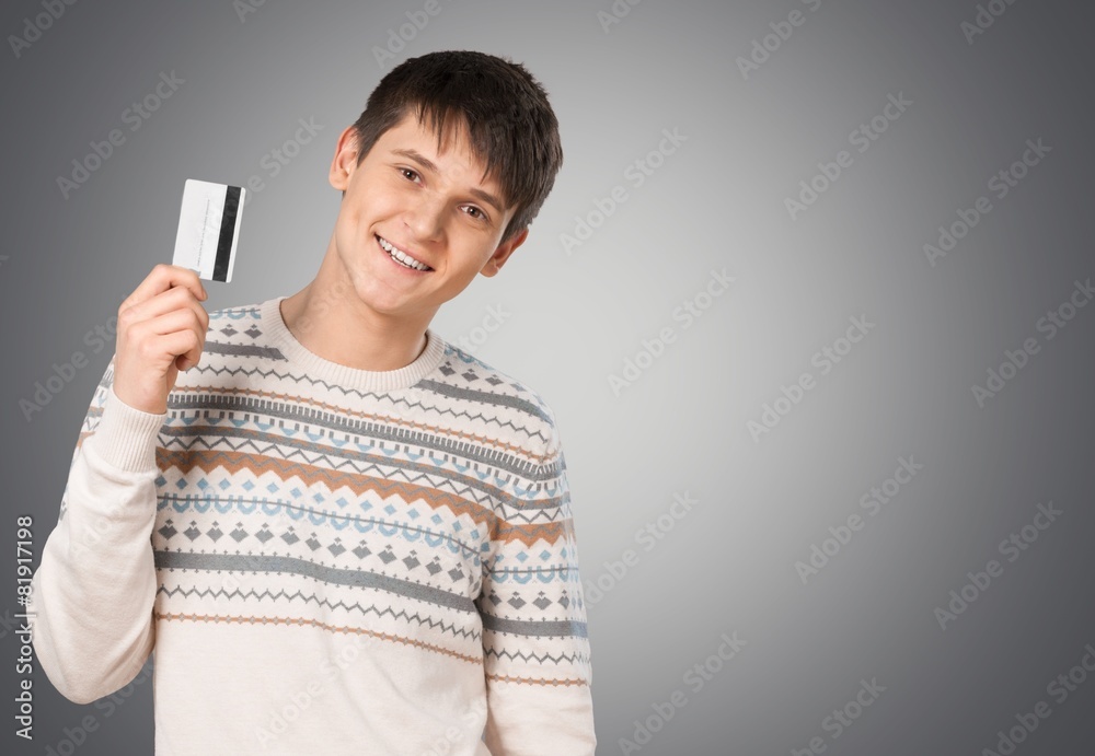 Credit Card. Smiling young man with credit card Credit Card. Smiling young man with credit card