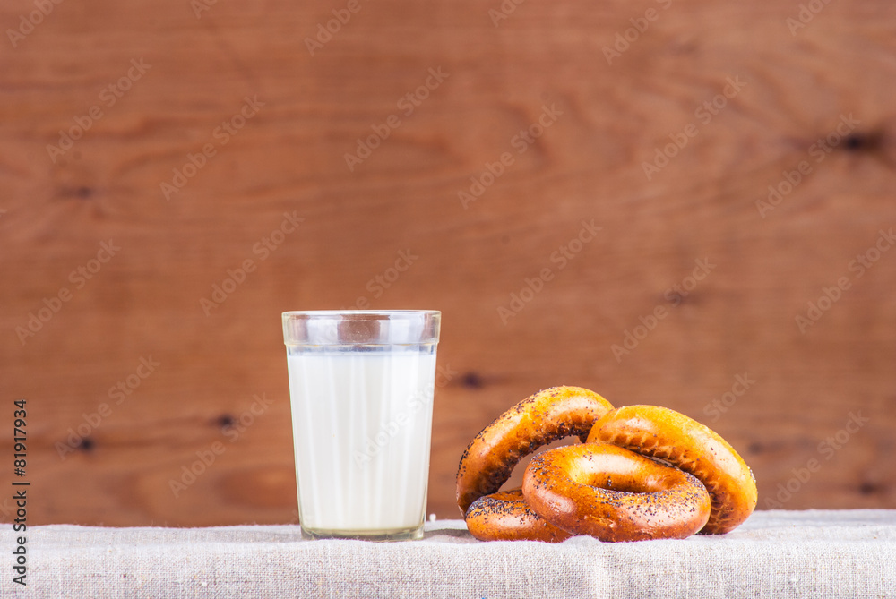 Cut loaf of fresh bread on burlap on wooden table Cut loaf of fresh bread on burlap on wooden table