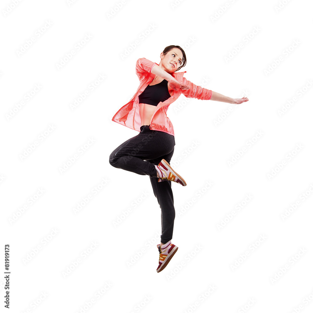 modern style dancer posing hodling leg on studio background