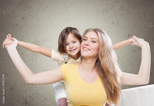 Background. CLoseup portrait of happy  white mother and young