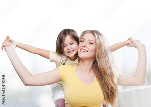 Background. CLoseup portrait of happy  white mother and young