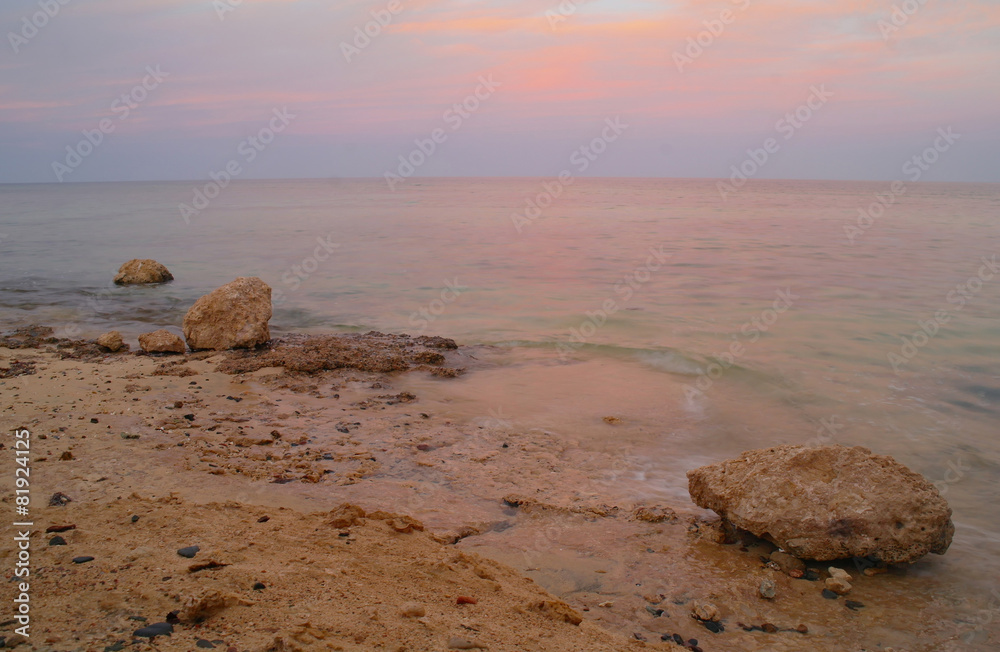 Beautiful seascape. Sea and rock at the sunset. Red sea, Egypt.