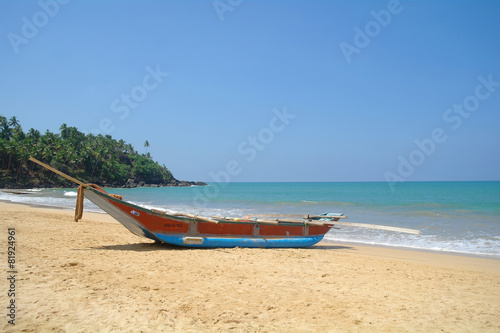 Exotic fisherman boat on beach near the ocean © ekulik2011