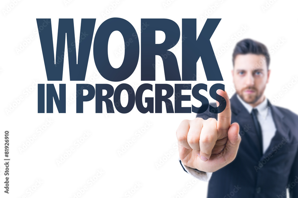 Business man pointing the text: Work in Progress Business man pointing the text: Work in Progress