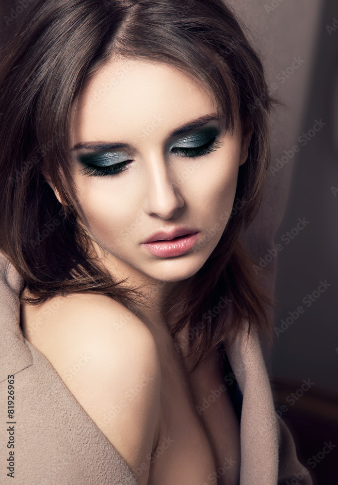 Seductive Young Fashion  Woman Portrait over Dark background.