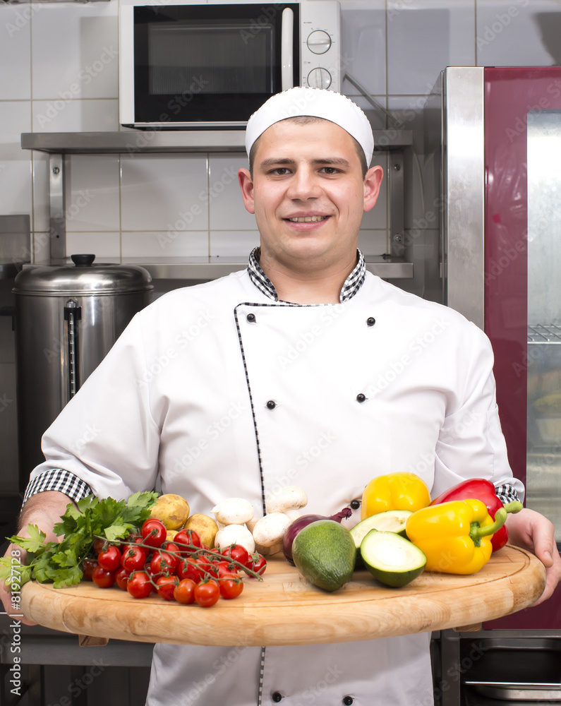 chef preparing food in the kitchen at the restaurant chef preparing food in the kitchen at the restaurant