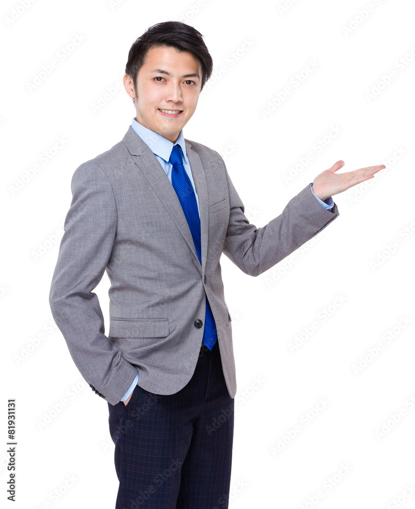 Asian business man standing with open hand Asian business man standing with open hand