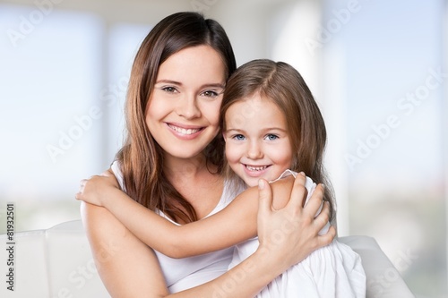 Fun. Happy family. Mother and baby daughter plays at home on the