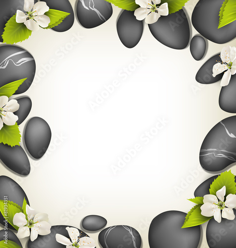 Spa stones with cherry white flowers like frame on beige backgro