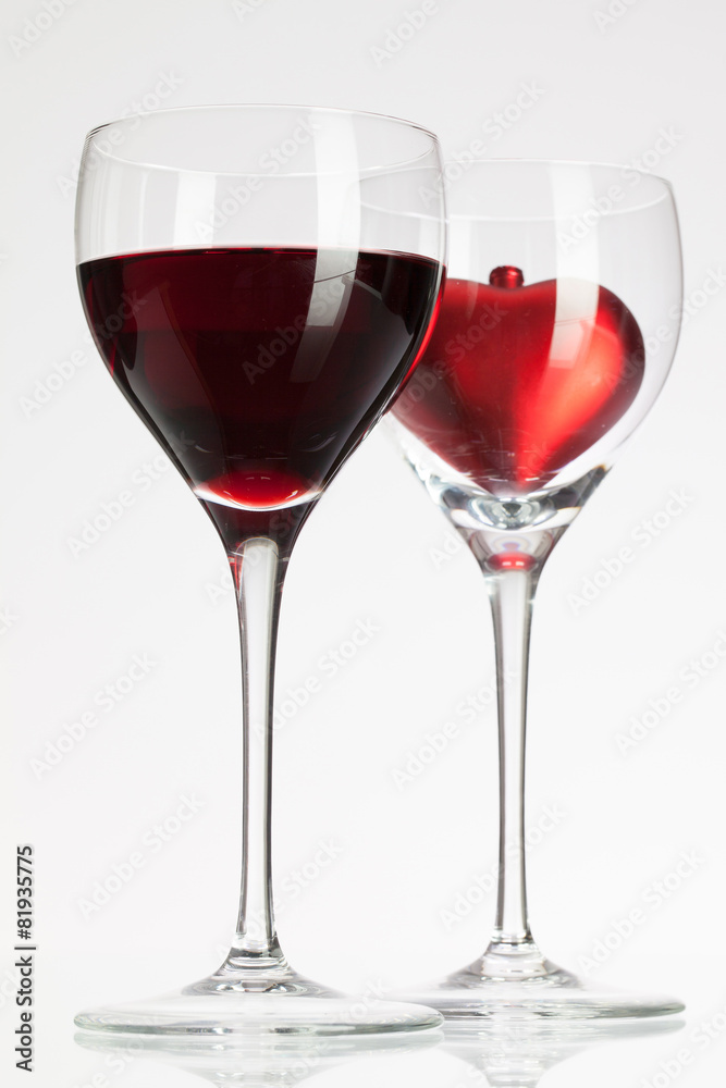 Wine glasses with red wine and heart