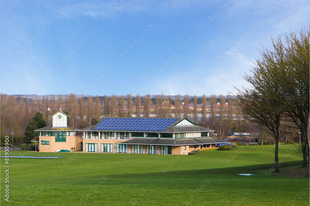 Obraz premium Cricket ground and pavilion in beautiful park in spring