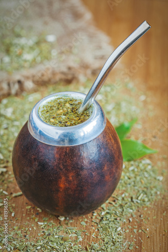 Latin traditional yerba mate tea in calabash with bombilla on