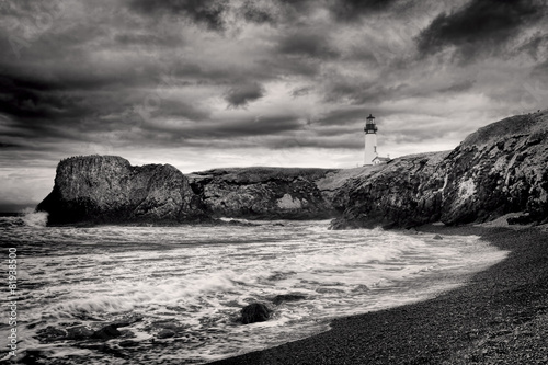 B&W of lighthouse on coast. photo