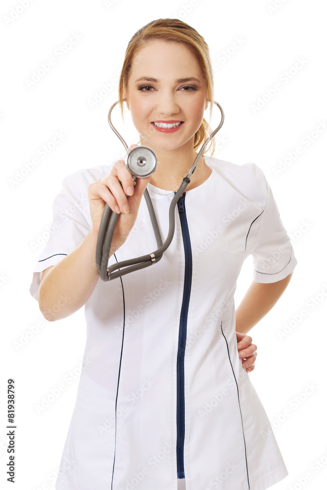 Young female doctor with stethoscope. Young female doctor with stethoscope.