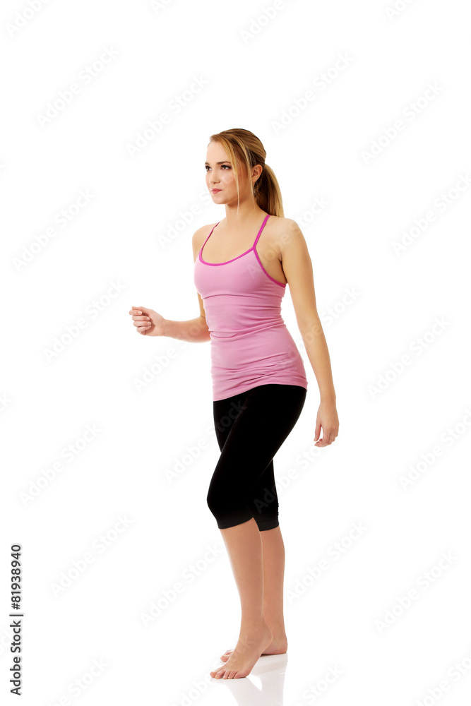 Young woman doing aerobic exercise. Young woman doing aerobic exercise.