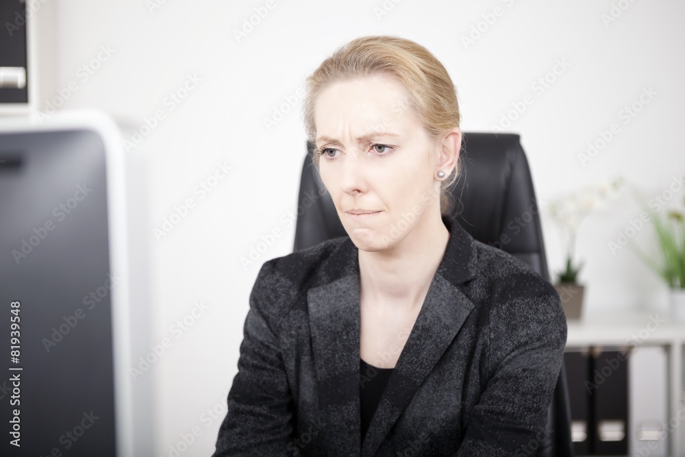 Pensive Office Woman Looking at Computer Screen Pensive Office Woman Looking at Computer Screen