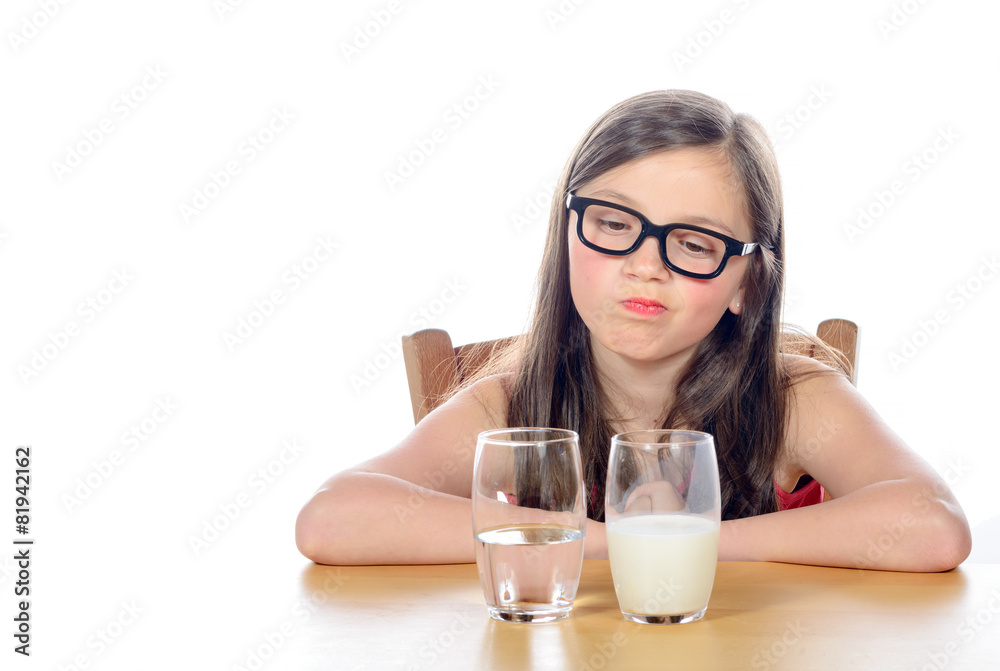 a little girl has a choice between water and milk a little girl has a choice between water and milk