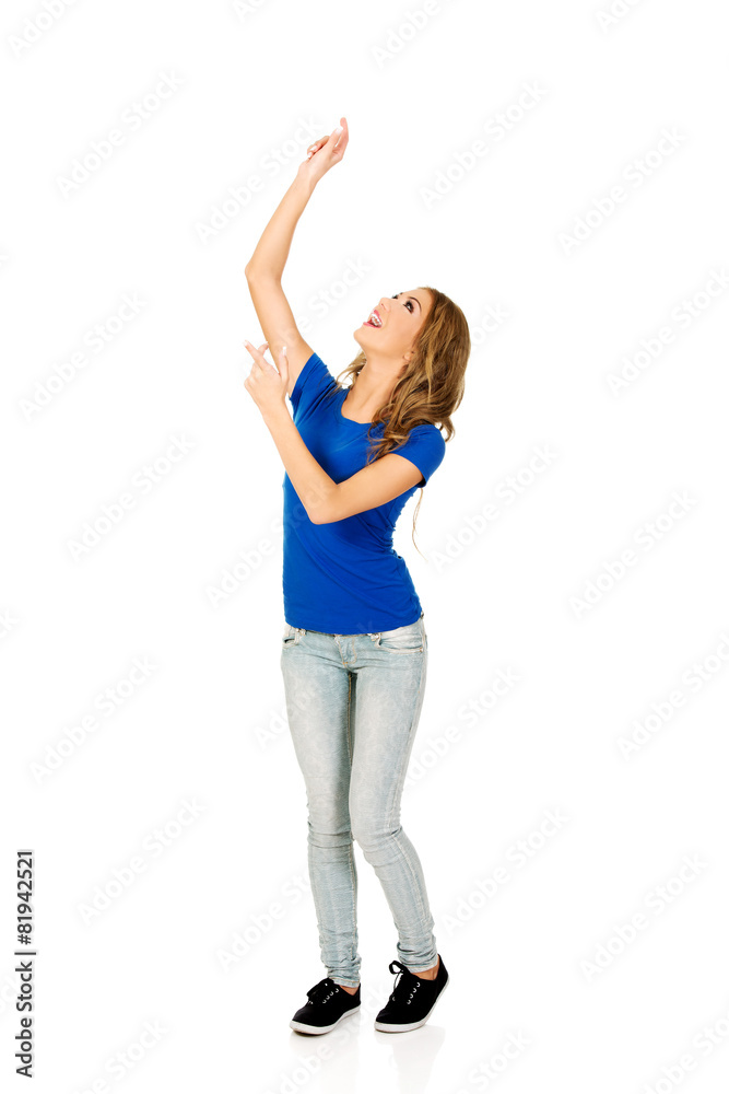 Young woman with arms raised. Young woman with arms raised.