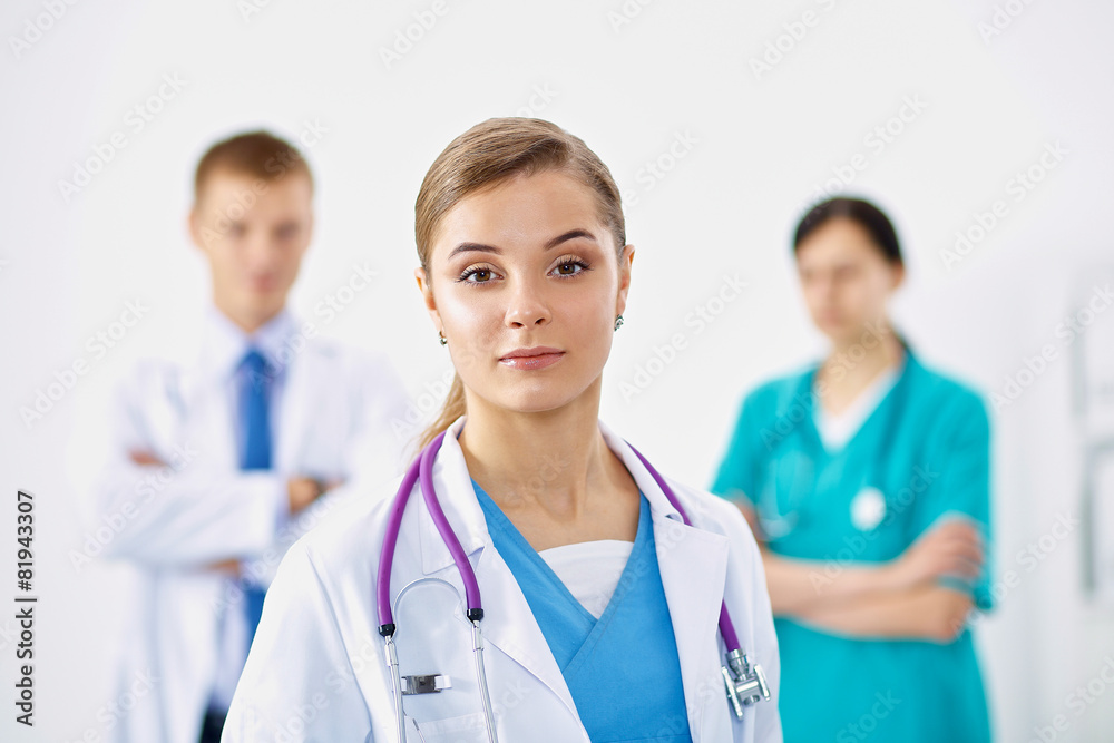 Woman doctor standing with stethoscope at hospital Woman doctor standing with stethoscope at hospital