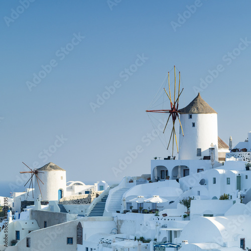 white city and mills on Santorini in Greece