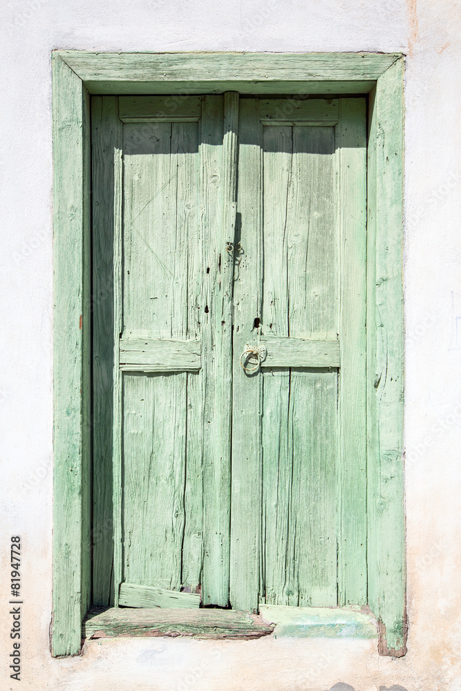 old green door on Santorini in Greece old green door on Santorini in Greece