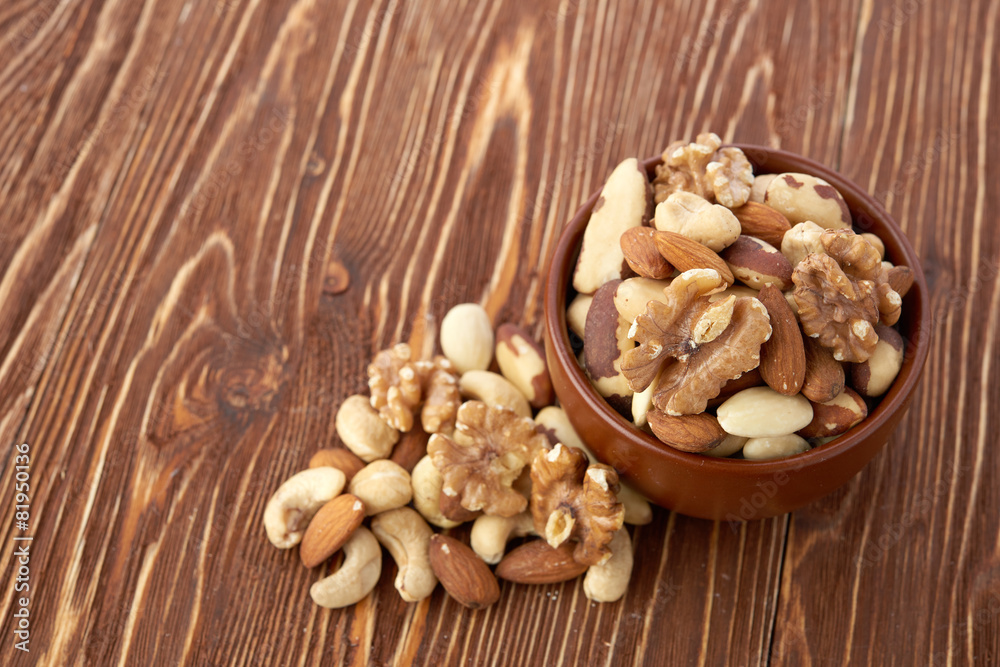 Mix nuts on wooden background Mix nuts on wooden background