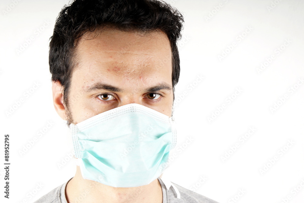 Studio shot of a young man with surgical mask