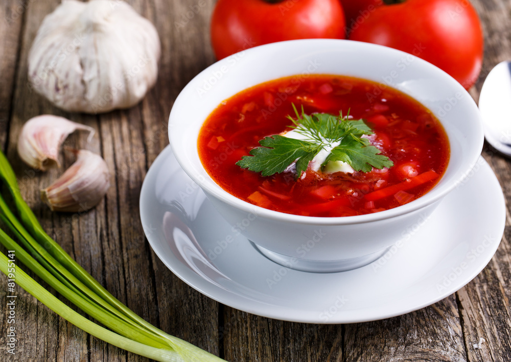 Borsch with bread on a wooden background. Borsch with bread on a wooden background.