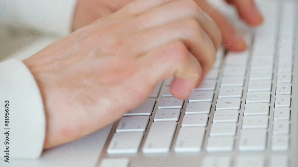 Hands typing on a keyboard Hands typing on a keyboard