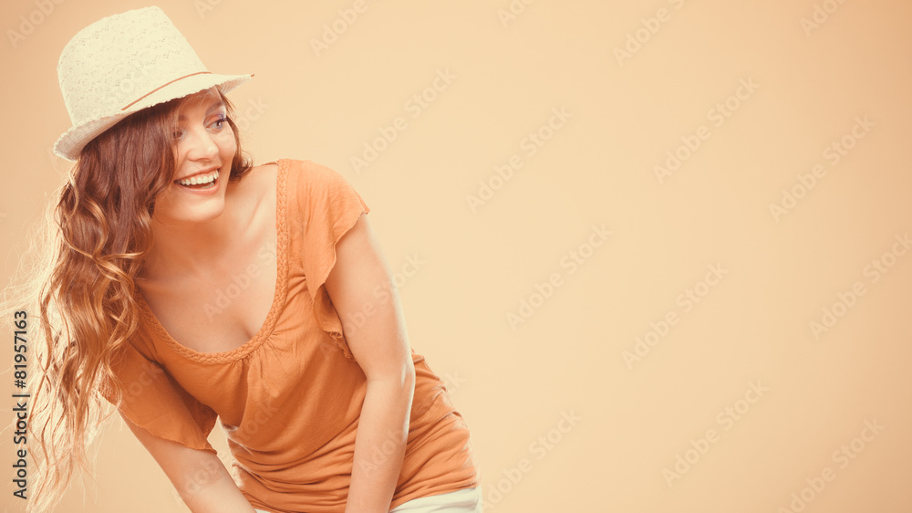 Charming woman in summer clothes straw hat