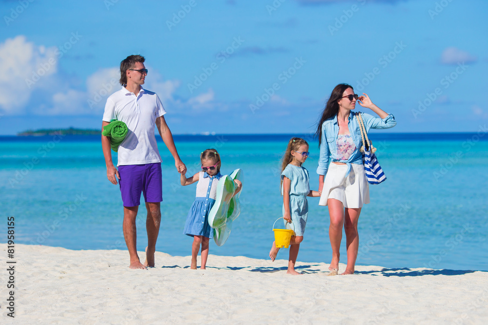 Young family of four on beach vacation Young family of four on beach vacation