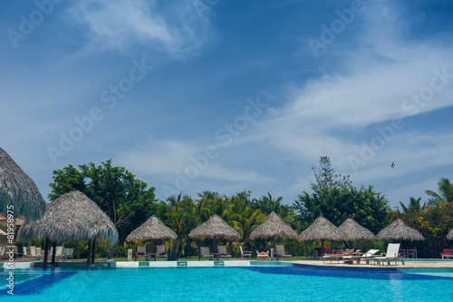 Outdoor resort Swimming pool of luxury hotel in summer spa near