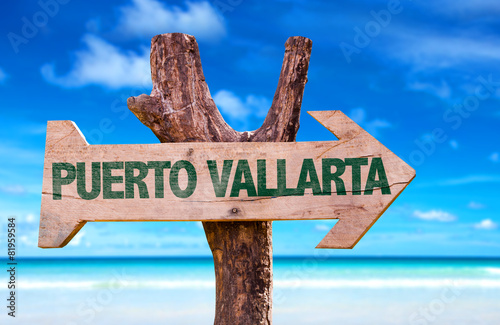 Puerto Vallarta wooden sign with beach background photo