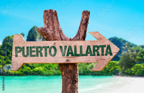 Puerto Vallarta wooden sign with beach background