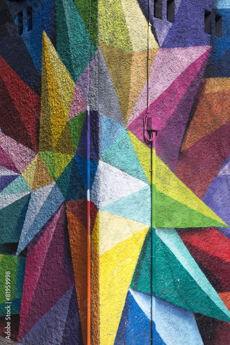 Colorful Graffiti detail on the textured wall