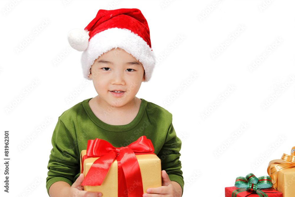 Smiling little boy with Christmas gift box Smiling little boy with Christmas gift box
