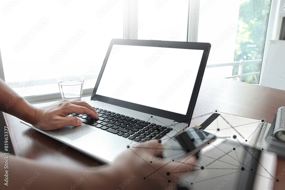 Businessman hand using laptop and mobile phone in office Businessman hand using laptop and mobile phone in office