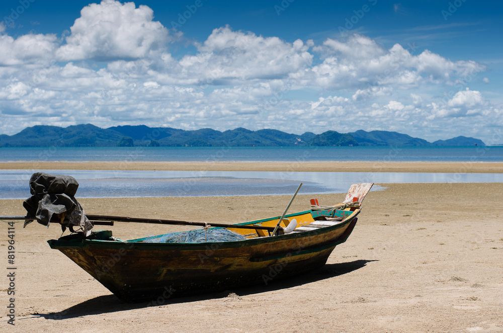 The Wood Boat On The Tranquil Beach.