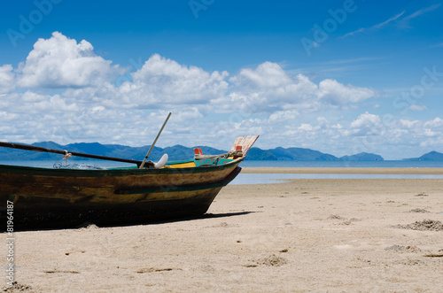 The Wood Boat On The Tranquil Beach.