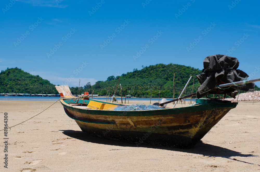 The Wood Boat On The Tranquil Beach.