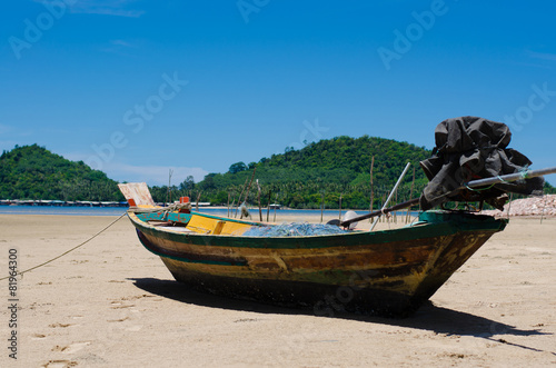 The Wood Boat On The Tranquil Beach.