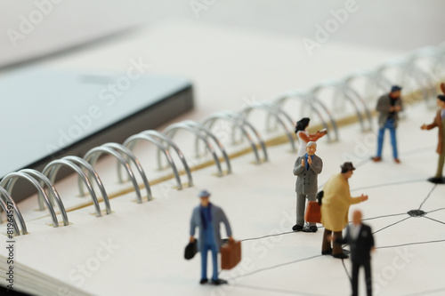 close up of miniature people with social network diagram on open © everythingpossible
