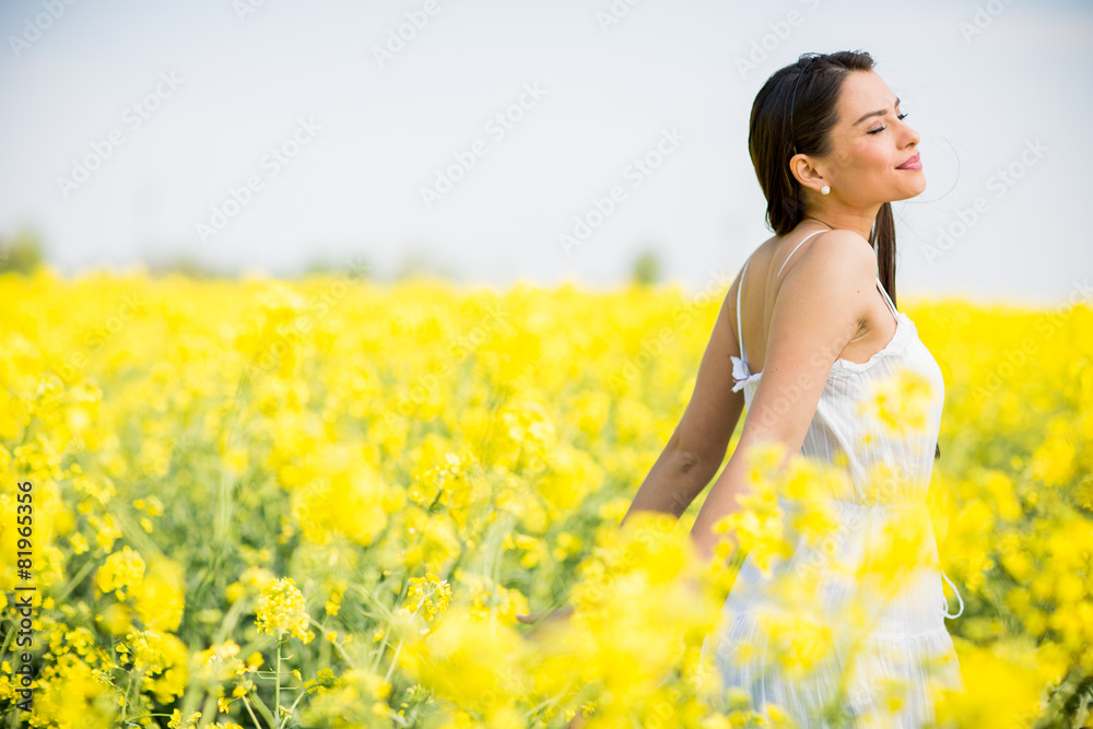 Young woman in the spring field Young woman in the spring field