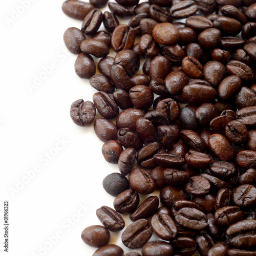 Brown coffee beans isolated on white background