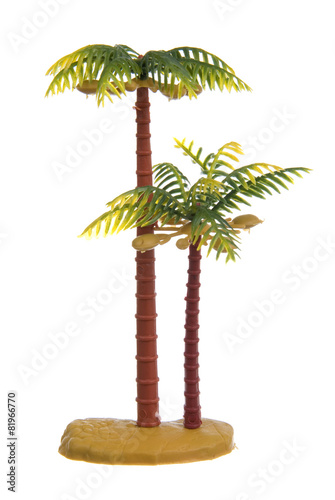 Plastic palm tree toy isolated on white background