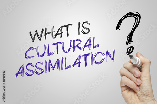 Photography Hand writing what is cultural assimilation